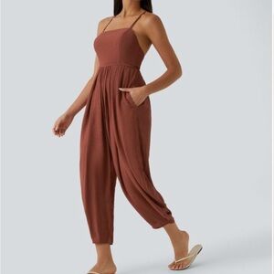 Halara jumpsuit.  Backless with pockets.